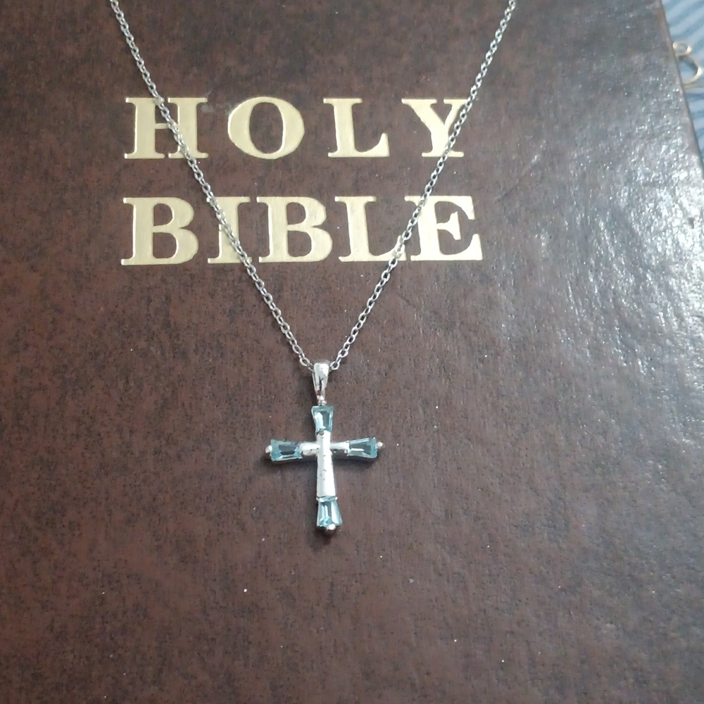 Elegant Silver Cross Pendant Necklace With Topaz Stones.
